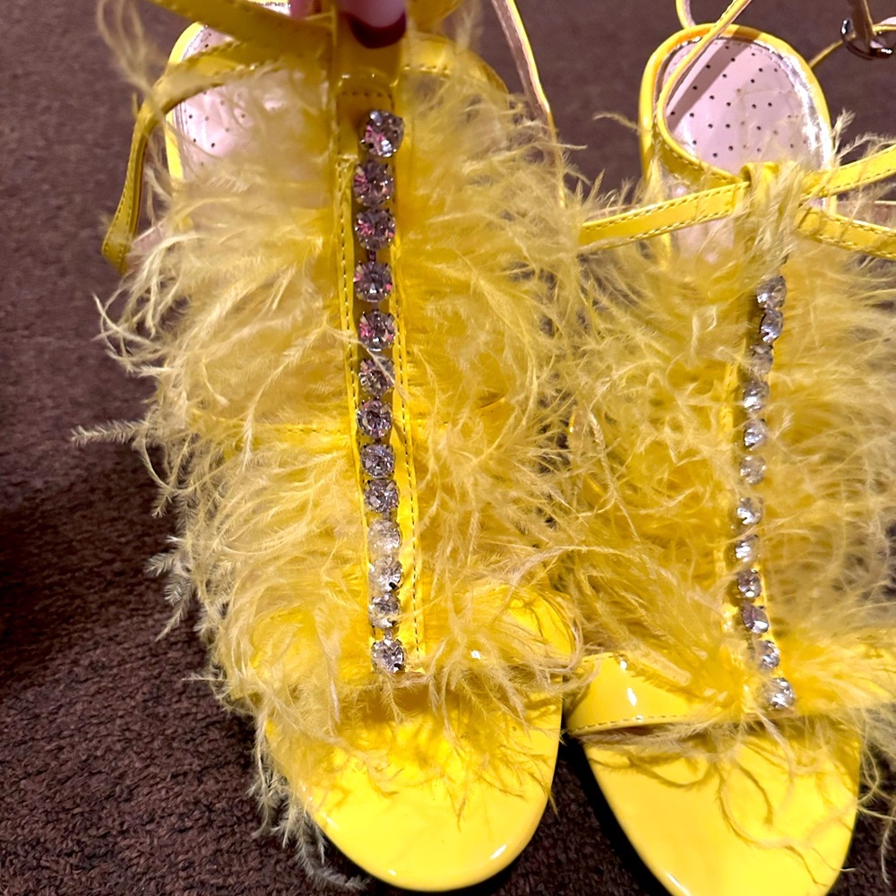 ￼ yellow feathered high heels